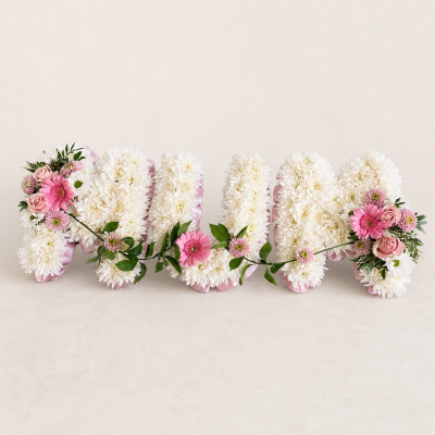MUM Pink & White Funeral Letter Tribute | Slough - Handcrafted MUM funeral letter tribute in pink and white, created by Four Seasons Florist in Slough. Contact us about colours and delivery timing.