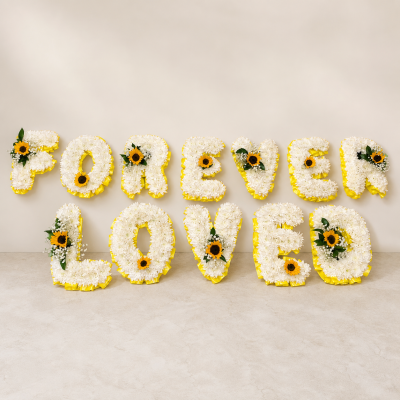 Sunflower Letter Tribute | Price Per Letter | Slough - Sunflower funeral letter tribute priced per letter, handcrafted by Four Seasons Florist in Slough. Contact us to confirm your chosen lettering.