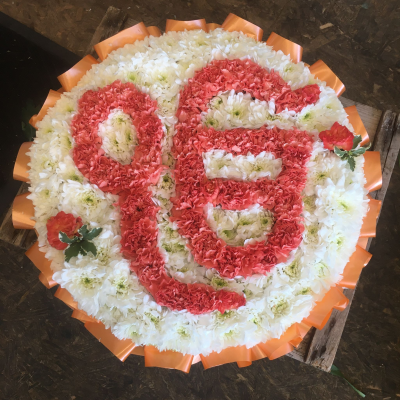 Ik Onkar Symbol Tribute - Ik Onkar symbol funeral tribute handcrafted in white and orange tones, creating a meaningful floral tribute for Sikh funerals and memorials.